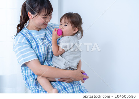 Kindergarteners and nursery teachers playing with balls 104506586