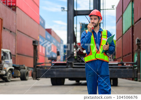 Warehouse engineer worker checking and working at industrial container station Warehouse engineer worker checking and working at industrial container station 104506676
