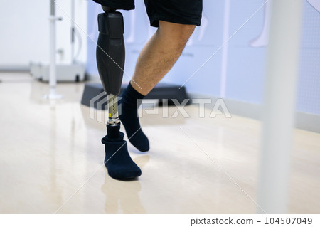 Disabled athlete patient with physical disability doing exercise Disabled athlete patient with physical disability doing exercise 104507049