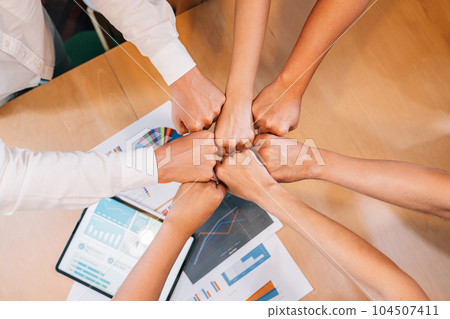 Happy group of business people meeting and brainstorming together Happy group of business people meeting and brainstorming together 104507411
