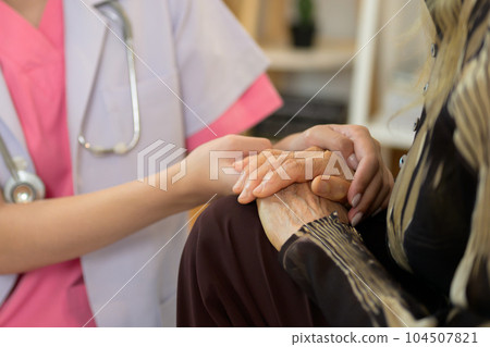 Professional doctor explaining prescription to senior patient at home visit Professional doctor explaining prescription to senior patient at home visit 104507821