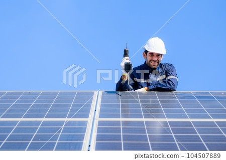 Technician worker installing solar panels at solar cell farm Technician worker installing solar panels at solar cell farm 104507889