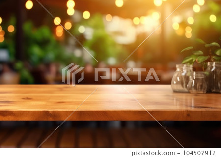 The empty wooden table top with blur background of indoor vintage cafe. Exuberant. The empty wooden table top with blur background of indoor vintage cafe. Exuberant. 104507912