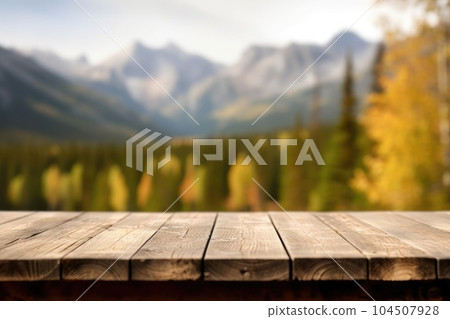 The empty wooden table top with blur background of Alaska nature. Exuberant. The empty wooden table top with blur background of Alaska nature. Exuberant. 104507928