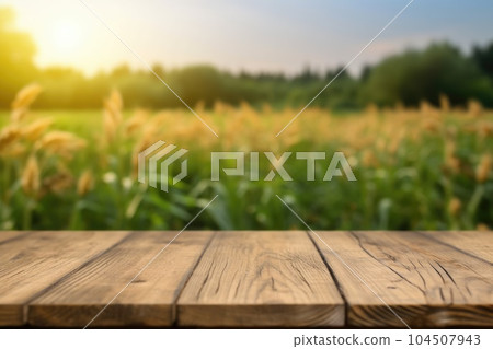 The empty wooden brown table top with blur background of corn field. Exuberant. The empty wooden brown table top with blur background of corn field. Exuberant. 104507943