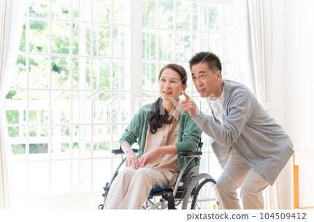 Husband who cares for his wife at home (senior, elderly, couple) Husband who cares for his wife at home (senior, elderly, couple) 104509412