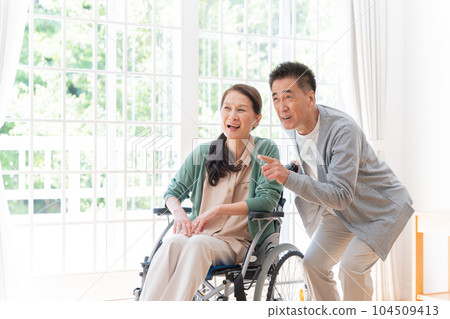 Husband who cares for his wife at home (senior, elderly, couple) Husband who cares for his wife at home (senior, elderly, couple) 104509413