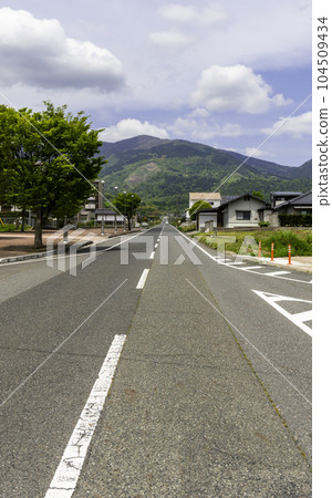 A straight road leading to Mt. Nagi, Nagi Town, Okayama Prefecture 104509434