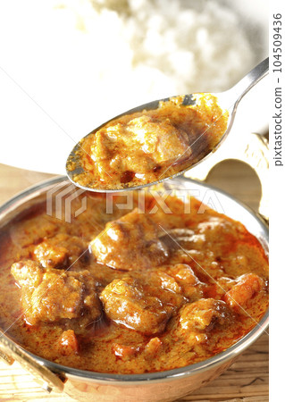 Eat spicy hot Indian curry with chicken 104509436