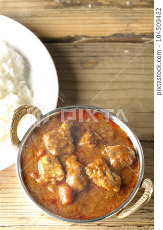 Hot spicy Indian curry with chicken and rice Hot spicy Indian curry with chicken and rice 104509482