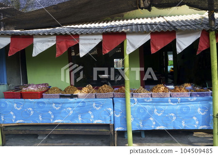 Crispy shrimps, crispy crabs and fried fish sold at food stands at Glagah beach in Kulonprogo, Indonesia 104509485