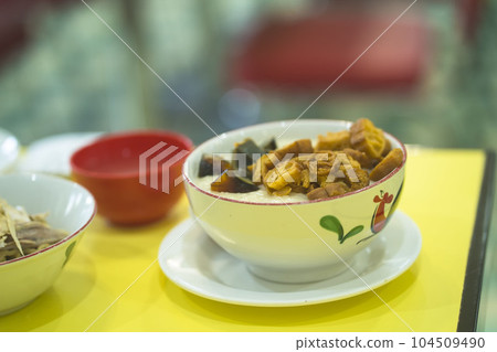 Chinese porridge with phitan egg served in a bowl. Chinese porridge with phitan egg served in a bowl. 104509490