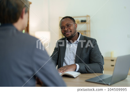 african american attorney, lawyers discussing contract or business agreement at law firm office, Business people making deal document legal, justice advice service concepts. african american attorney, lawyers discussing contract or business agreement at law firm office, Business people making deal document legal, justice advice service concepts. 104509995