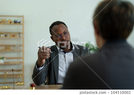 african american attorney, lawyers discussing contract or business agreement at law firm office, Business people making deal document legal, justice advice service concepts. african american attorney, lawyers discussing contract or business agreement at law firm office, Business people making deal document legal, justice advice service concepts. 104510002