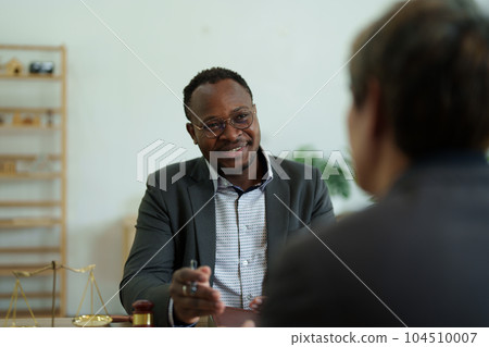 african american attorney, lawyers discussing contract or business agreement at law firm office, Business people making deal document legal, justice advice service concepts. 104510007