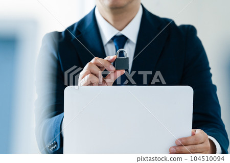 Businessman with key Businessman with key 104510094
