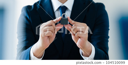 Businessman with key Businessman with key 104510099