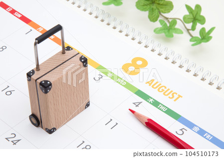 August calendar and suitcase 104510173