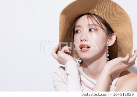 Beauty Summer Woman wearing a straw hat 104511029