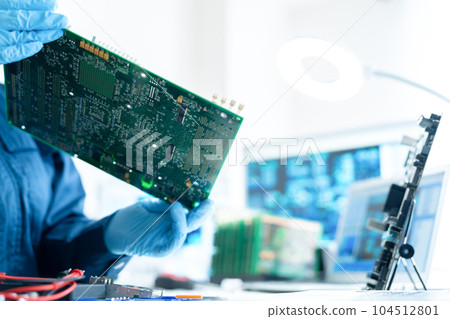 Engineer inspecting the board 104512801