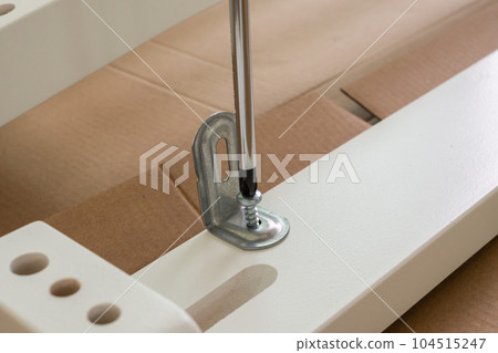 Assembly furniture using screwdriver at home 104515247