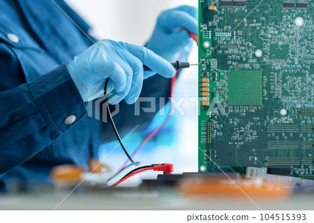 Engineer inspecting the board 104515393