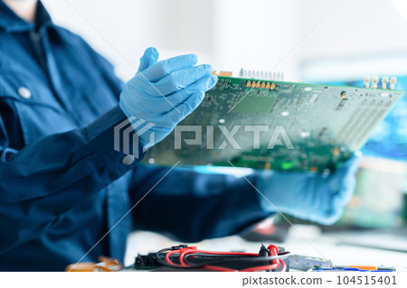Engineer inspecting the board 104515401