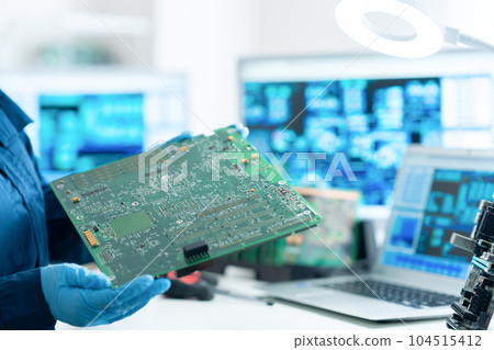 Engineer inspecting the board 104515412