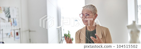 Fashion designer with glasses and pin pillow in wrist shoots vid 104515502
