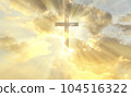 Christian cross appears bright in the gold sky 104516322