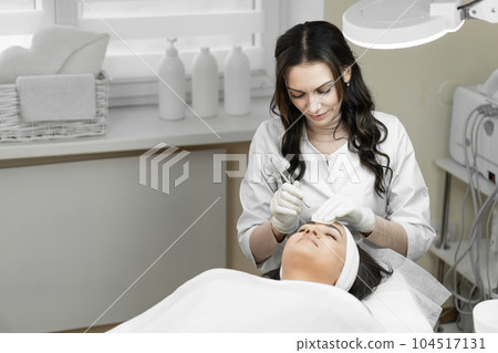 The photo shows the moments and relaxation that accompany a deep cleansing of the skin of the face, creating an unsurpassed experience self-care and maintaining skin health at procedure at beautician The photo shows the moments and relaxation that accompany a deep cleansing of the skin of the face, creating an unsurpassed experience self-care and maintaining skin health at procedure at beautician 104517131