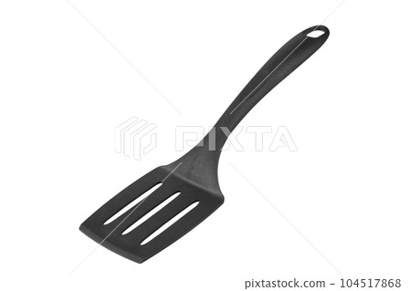 Black plastic cooking spatula isolated on white background. Kitchen utensils. Black plastic cooking spatula isolated on white background. Kitchen utensils. 104517868