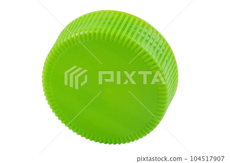 Plastic bottle caps of green color isolated against a white background. Plastic bottle caps of green color isolated against a white background. 104517907