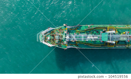 Aerial top view ship tanker crude oil on the sea for transportation, Sea transportation of crude oil petroleum tanker to oil terminal for loading and global business loogistic. Aerial top view ship tanker crude oil on the sea for transportation, Sea transportation of crude oil petroleum tanker to oil terminal for loading and global business loogistic. 104519556