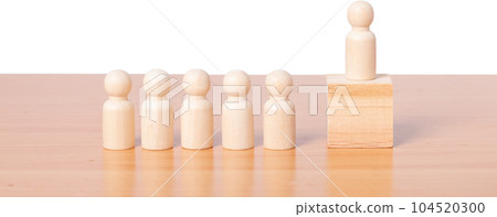 Wood person model standing on the podium among people. Wood person model standing on the podium among people. 104520300