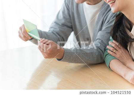 Senior couple looking at the passbook Senior couple looking at the passbook 104521530