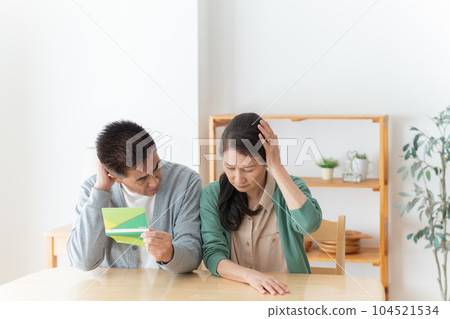Senior couple looking at the passbook 104521534