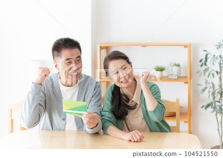 Senior couple looking at the passbook Senior couple looking at the passbook 104521550