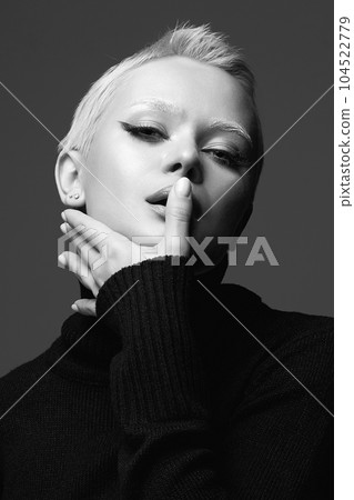 black and white portrait of Short Hair Beautiful young woman with white snow brows 104522779