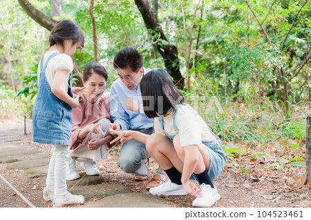 Grandchildren playing at their grandparents' house in the countryside 104523461