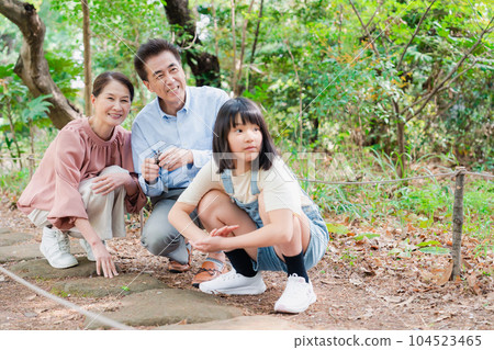 Grandchildren playing at their grandparents' house in the countryside 104523465