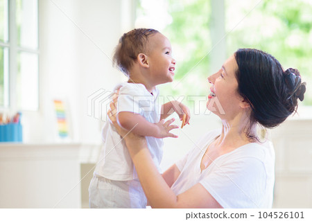 Baby and mother at home. Mom and child. Baby and mother at home. Mom and child. 104526101