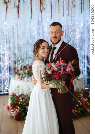 portrait of a young couple of newlyweds in wedding looks 104526206