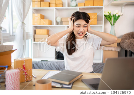 Overwhelmed and Discouraged: Small Business Owner Faces Fall Stress and Financial Losses, Disappointed: Emotional Struggles of a Stressed Woman in the Business World, Disillusionment in Business. 104526970