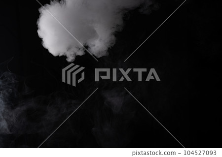 Cloud of white smoke on a black background closeup Cloud of white smoke on a black background closeup 104527093