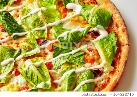 Green lettuce and cream cheese sauce on top of delicious pizza Green lettuce and cream cheese sauce on top of delicious pizza 104528710