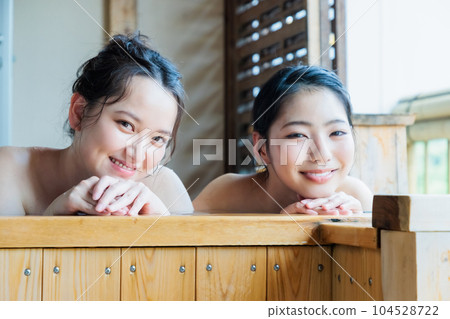 Young women relaxing in a cypress bath 104528722