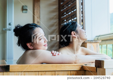 Young women relaxing in a cypress bath 104528740