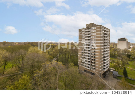 an apartment building with trees in the foreground and buildings on the other side of the photo, taken from above an apartment building with trees in the foreground and buildings on the other side of the photo, taken from above 104528914