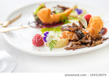 Shrimp tempura with potato mousse, shiitake mushrooms and sauce isolated Shrimp tempura with potato mousse, shiitake mushrooms and sauce isolated 104529074